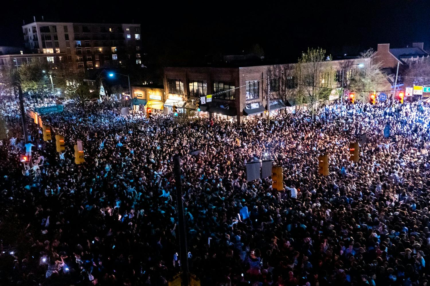 A photo of students on Franklin Street after UNC beat Duke in 2022 in the college Basketball Final Four.