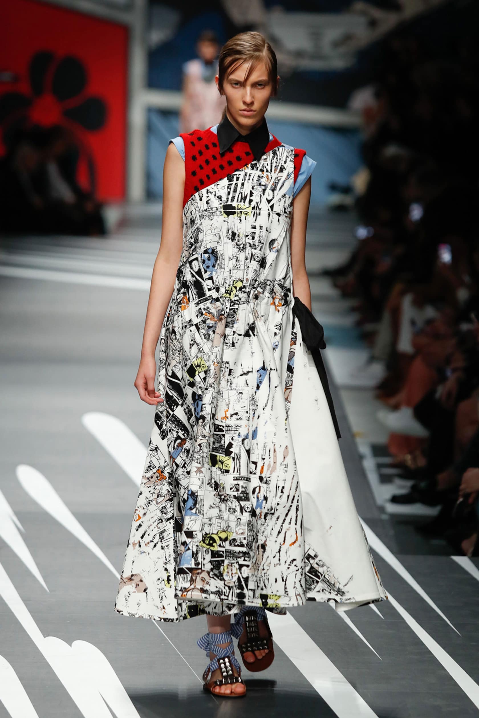 A photo of a unway model in a Prada outfit